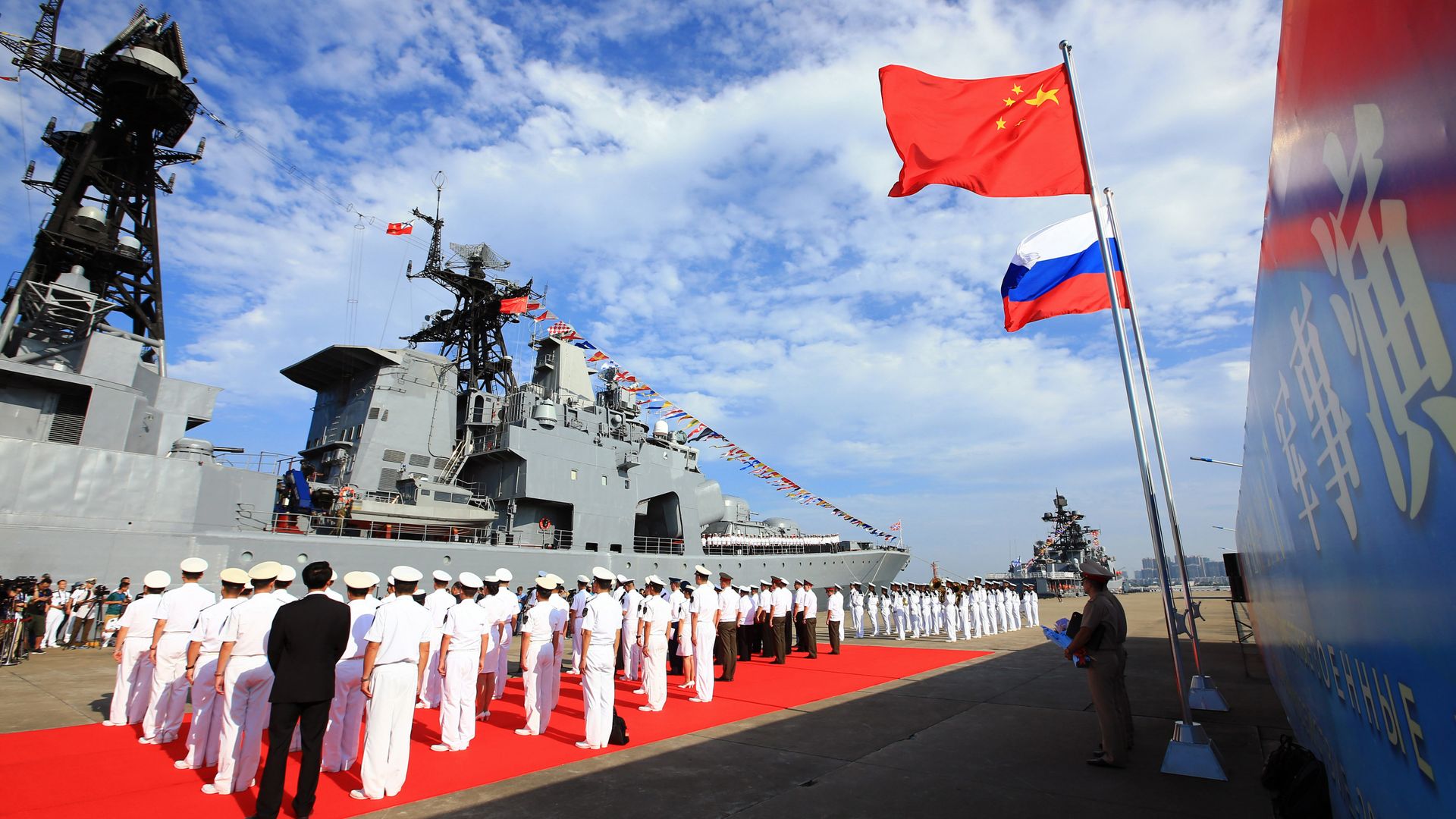 In this photo released by China's Xinhua News Agency, officers and soldiers of China's People's Liberation Army (PLA) Navy hold a welcome ceremony as a Russian naval ship arrives in port in Zhanjiang in southern China's Guangdong Province, Monday, Sept. 12, 2016 In this photo released by China's Xinhua News Agency, officers and soldiers of China's People's Liberation Army (PLA) Navy hold a welcome ceremony as a Russian naval ship arrives in port in Zhanjiang in southern China's Guangdong Province, Monday, Sept. 12, 2016 - Sputnik India, 1920, 05.07.2026