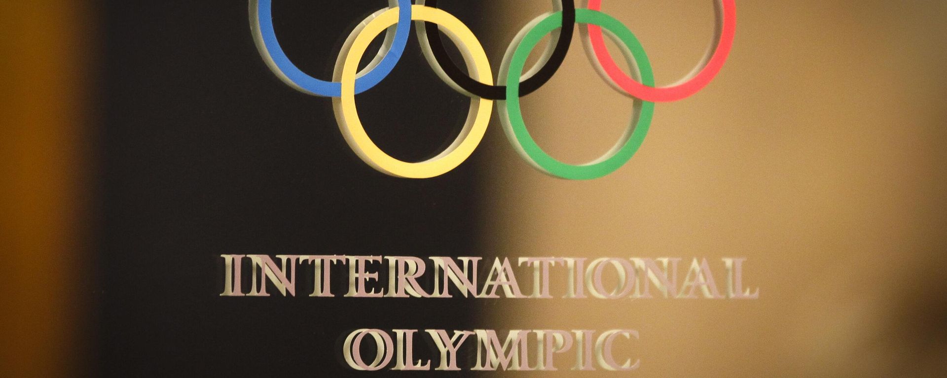 The International Olympic Committee (IOC) logo is seen on the door at a meeting of the IOC Executive Board at a hotel in London, prior to the 2012 Summer Olympics, Saturday, July 21, 2012 - Sputnik India, 1920, 07.07.2026