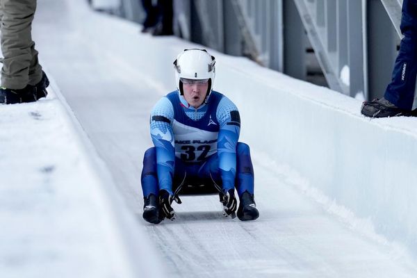Matvei Perestoronin, a Russian luge athlete, finishes a qualifying race to compete in a Luge World Cup event in Lake Placid, New York, on December 18, 2025. - Sputnik India