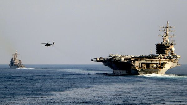 The aircraft carrier USS Dwight D. Eisenhower and other warships crosses the Strait of Hormuz into the Persian Gulf on Sunday, Nov. 26, 2023 - Sputnik India