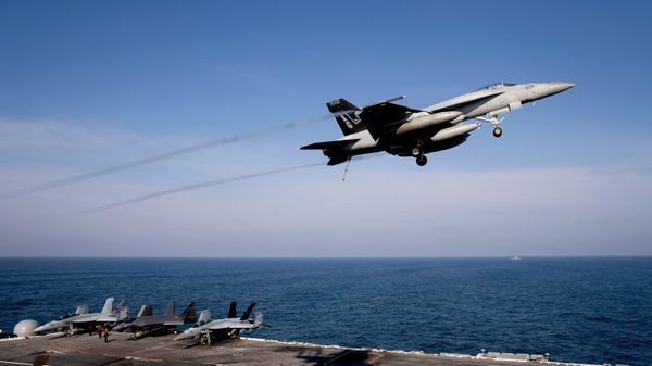 An F/A-18 Super Hornet fighter jet flies over the deck of the nuclear-powered aircraft carrier USS George Washington during joint exercises, off the coast of Argentina, Thursday, May 30, 2024 - Sputnik भारत