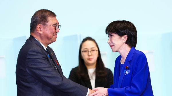 Newly-elected leader of Japan's Liberal Democratic Party (LDP) Sanae Takaichi, right, shakes hands with Prime Minister Shigeru Ishiba after winning the LDP leadership election i in Tokyo, Japan, Saturday, Oct. 4, 2025 - Sputnik India
