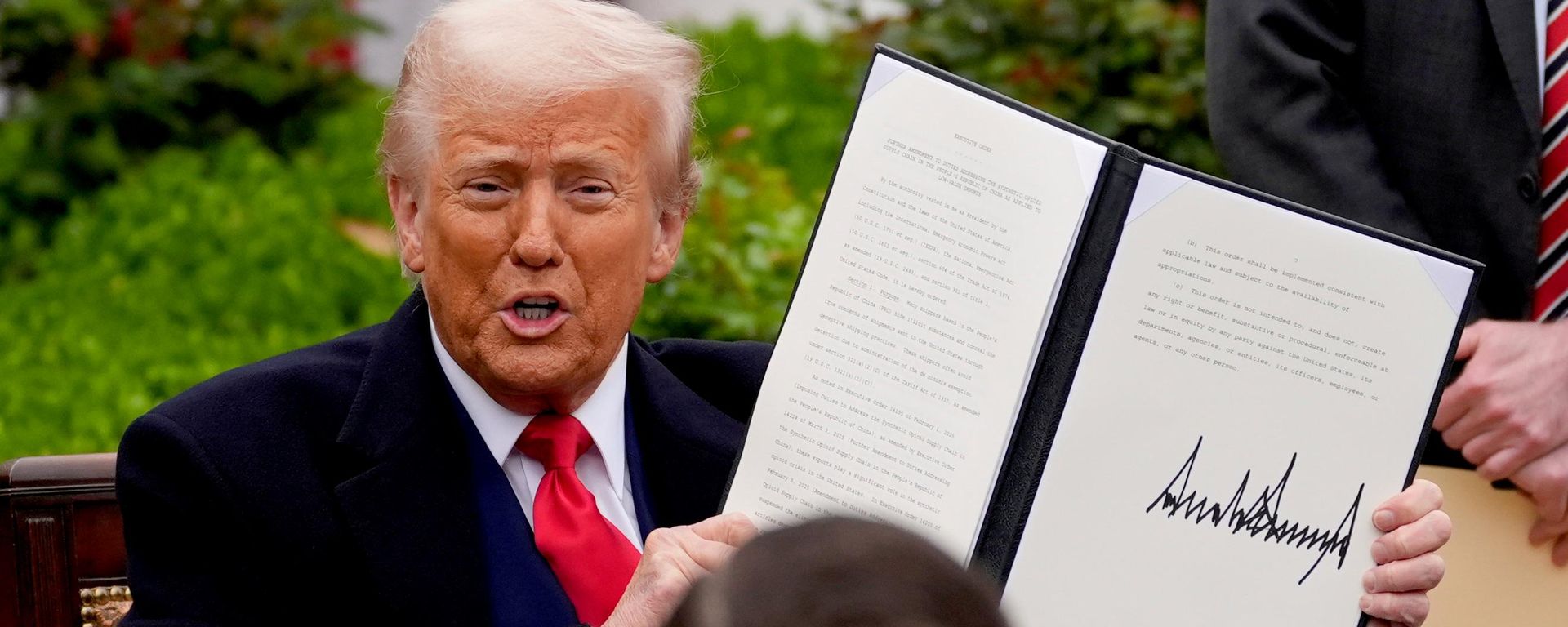 President Donald Trump holds a signed executive order during an event to announce new tariffs in the Rose Garden of the White House, Wednesday, April 2, 2025, in Washington - Sputnik भारत, 1920, 23.10.2026