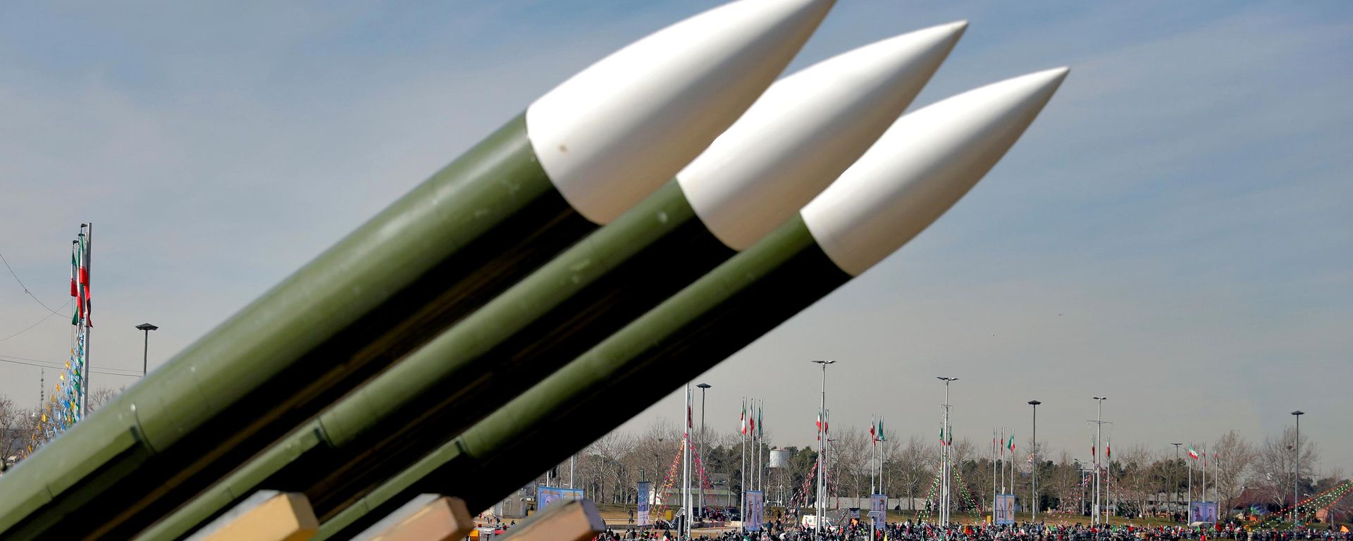 Iranians drive past missiles by their motorcycles during a rally marking the 42nd anniversary of the Islamic Revolution, at Azadi (Freedom) Square in Tehran, Iran, Wednesday, Feb. 10, 2021 - Sputnik भारत, 1920, 02.08.2026
