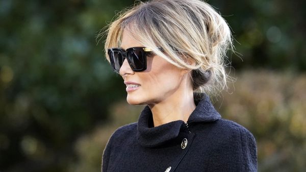 First Lady Melania Trump listens as President Donald Trump speaks with reporters as he walks to board Marine One on the South Lawn of the White House, Wednesday, Jan. 20, 2021, in Washington - Sputnik भारत