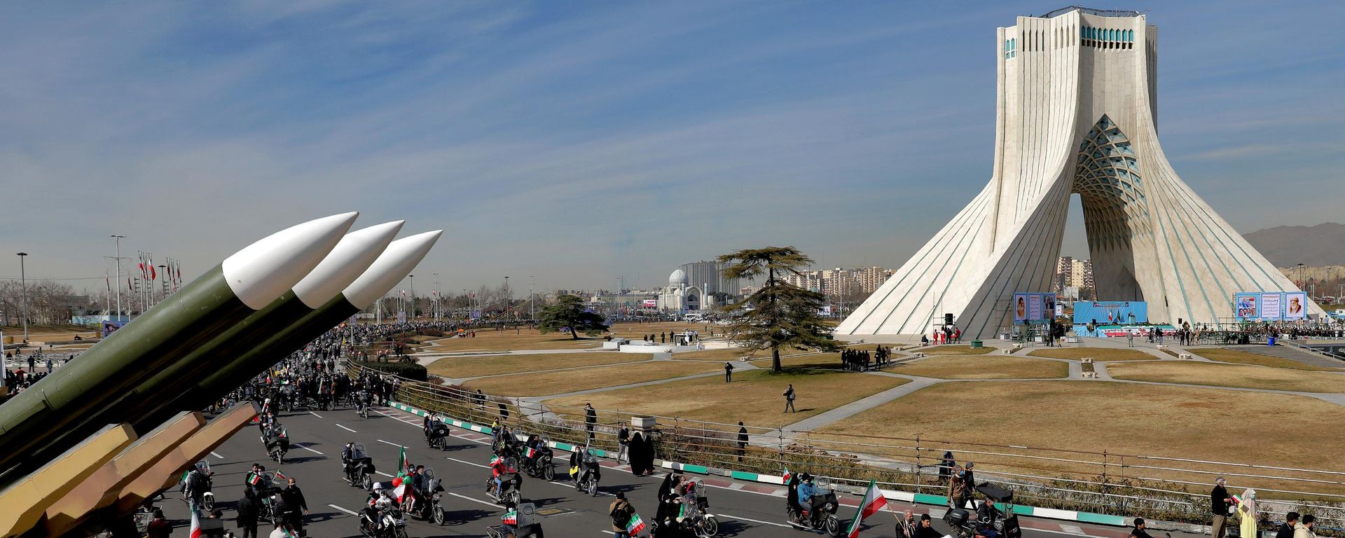 ranians drive past missiles by their motorcycle during a rally marking the 42nd anniversary of the Islamic Revolution, at Azadi (Freedom) Square in Tehran, Iran, Wednesday, Feb. 10, 2021 - Sputnik भारत, 1920, 04.08.2026