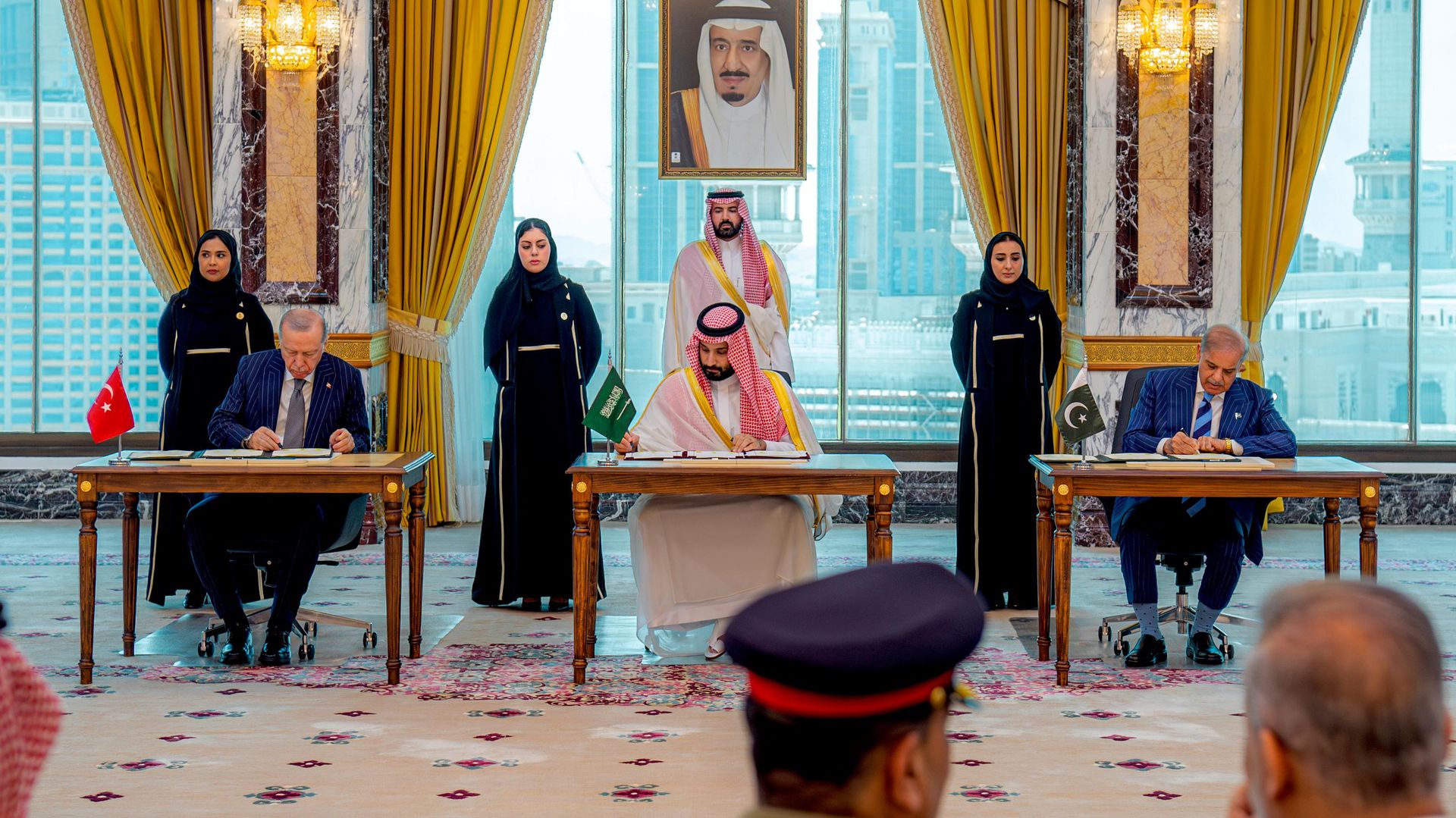 From left, Turkish President Recep Tayyip Erdogan, Saudi Crown Prince Mohammed bin Salman and Pakistani Prime Minister Shehbaz Sharif sign a trilateral defense agreement in Mecca, Saudi Arabia, Friday, Aug. 7, 2026.  - Sputnik भारत, 1920, 08.08.2026