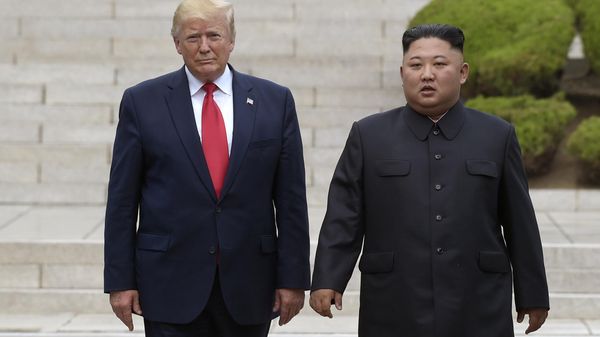Then US President Donald Trump, left, meets with North Korean leader Kim Jong-Un at the North Korean side of the border at the village of Panmunjom in Demilitarized Zone, on June 30, 2019. - Sputnik भारत