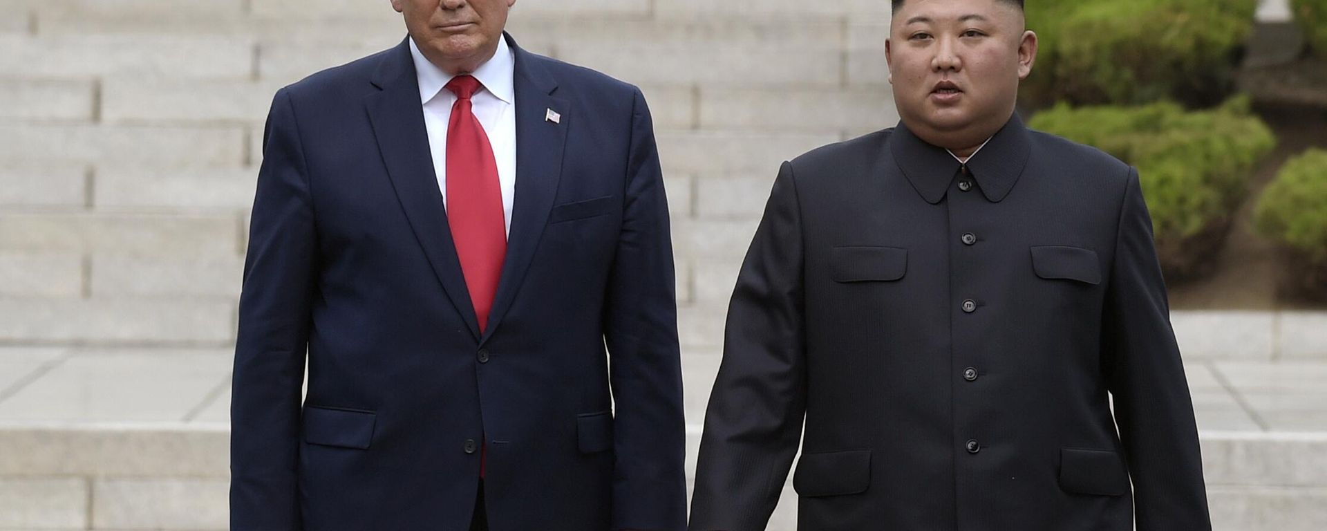 Then US President Donald Trump, left, meets with North Korean leader Kim Jong-Un at the North Korean side of the border at the village of Panmunjom in Demilitarized Zone, on June 30, 2019. - Sputnik भारत, 1920, 17.08.2026