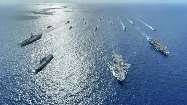 In this photo released by the U.S. Indo-Pacific Command, the United Kingdom's carrier strike group led by HMS Queen Elizabeth (R 08), and Japan Maritime Self-Defense Forces led by (JMSDF) Hyuga-class helicopter destroyer JS Ise (DDH 182) joined with U.S.  - Sputnik India