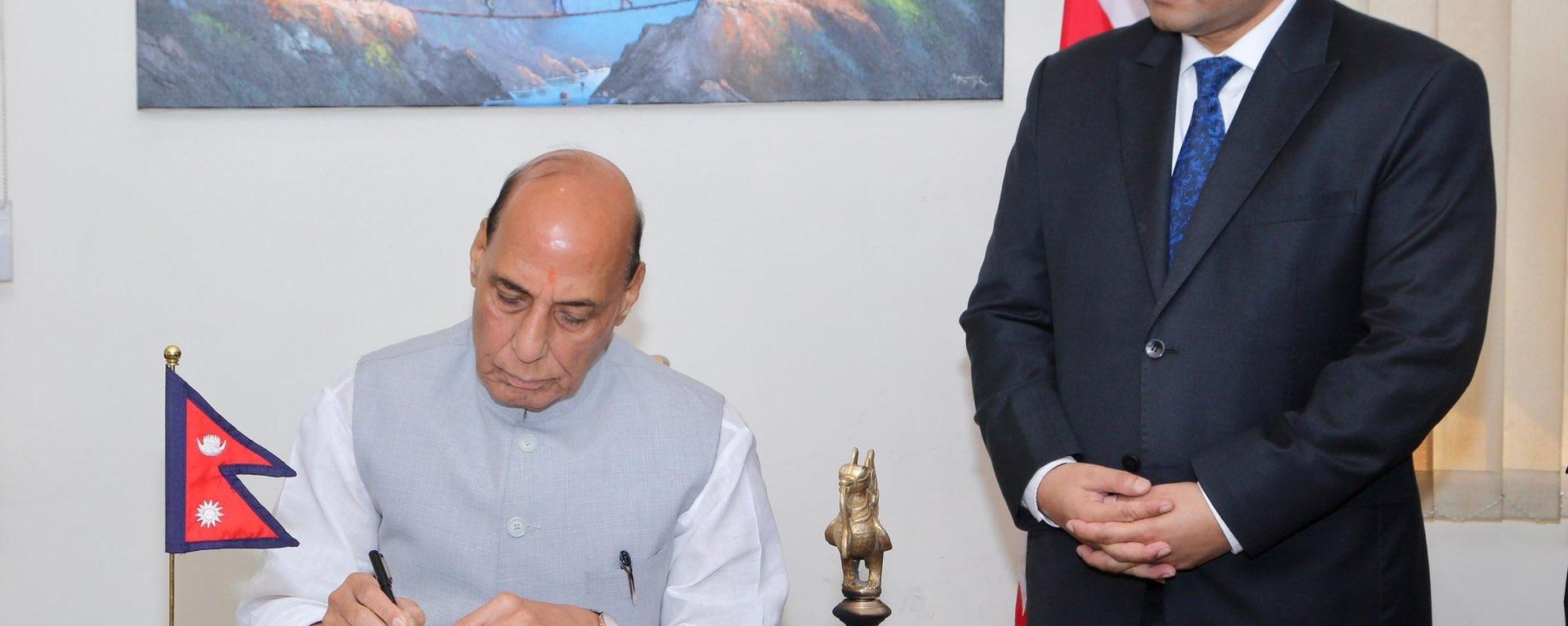 Indian Defence Minister Rajnath Singh signs the condolence book at the Embassy of Nepal in New Delhi. - Sputnik भारत, 1920, 31.08.2026