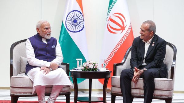 PM Narendra Modi with Iranian President Masood Pezeshkian at SCO Summit in Bishkek - Sputnik India