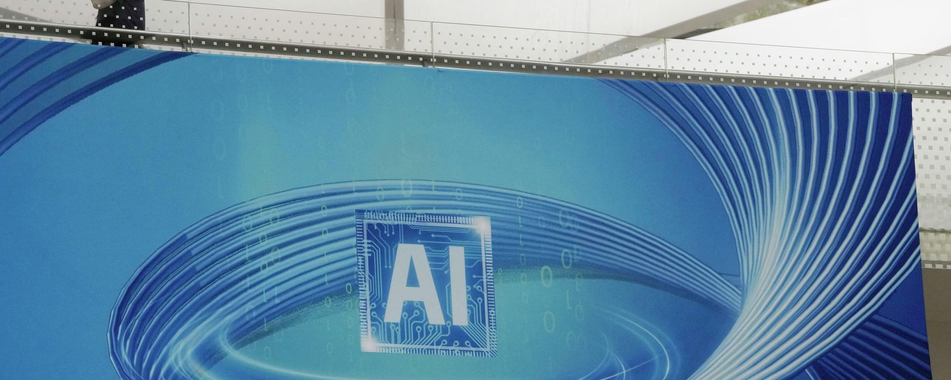 A visitor past by an ad promoting Artificial Intelligence for the upcoming World Artificial Intelligence Conference held in Shanghai, Wednesday, July 5, 2023. (AP Photo/Ng Han Guan) - Sputnik भारत, 1920, 15.09.2026