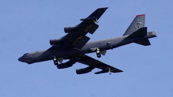 A U.S. B-52 Stratofortress bomber flies over East Hagatna in Guam on Monday afternoon, March 10, 2003.  - Sputnik India